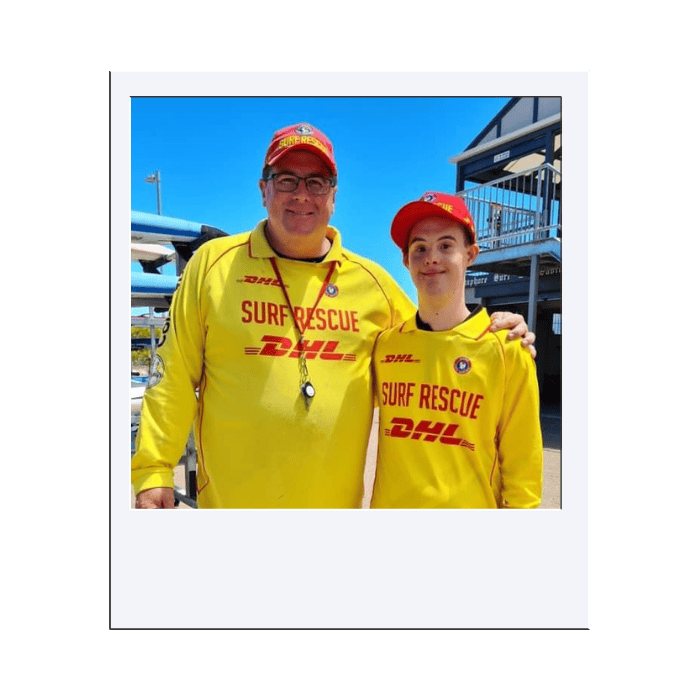 Beach rescue team in yellow surf rescue uniforms, representing community safety and emergency response supported by NDIS initiatives.
